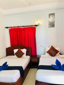 Postel nebo postele na pokoji v ubytování Golden Papaya Guesthouse