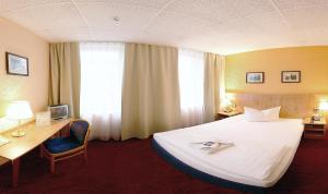 Postel nebo postele na pokoji v ubytování Hotel Adler Leipzig + 31 fotografií