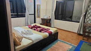 Rúm í herbergi á Hotel Mystic Kakani