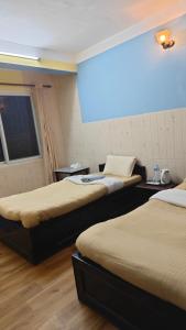Rúm í herbergi á Hotel Mystic Kakani