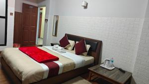 Rúm í herbergi á Hotel Mystic Kakani