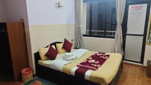 Rúm í herbergi á Hotel Mystic Kakani