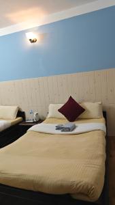 Rúm í herbergi á Hotel Mystic Kakani