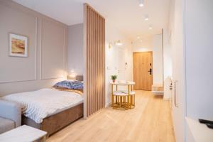 Postel nebo postele na pokoji v ubytování Global Apartments Katowice