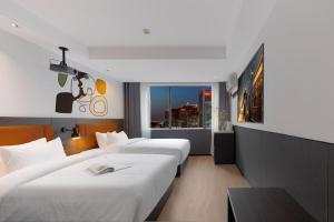 Postel nebo postele na pokoji v ubytování Mcsrh Hotel-Shenzhen Liutang