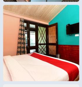 a bedroom with a bed with a red and white blanket at yog chhaya hotel in Shimla