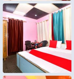 a bedroom with a large bed with colorful curtains at yog chhaya hotel in Shimla