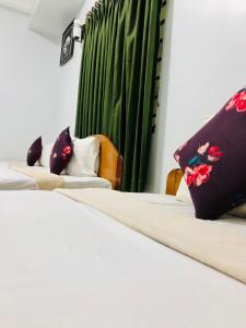 Postel nebo postele na pokoji v ubytování Golden Papaya Guesthouse