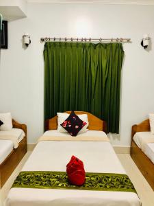 Postel nebo postele na pokoji v ubytování Golden Papaya Guesthouse