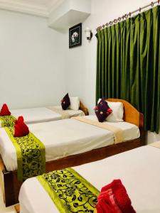 Postel nebo postele na pokoji v ubytování Golden Papaya Guesthouse