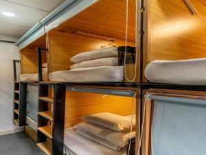 Postel nebo postele na pokoji v ubytování AMANGO HOSTEL