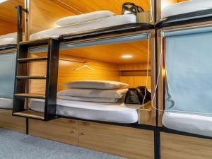 Postel nebo postele na pokoji v ubytování AMANGO HOSTEL