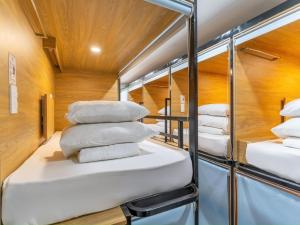 Postel nebo postele na pokoji v ubytování AMANGO HOSTEL
