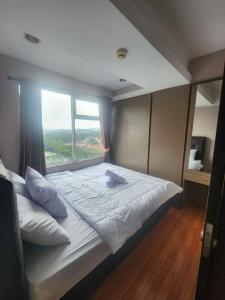 Postel nebo postele na pokoji v ubytování Jardin A22, City View, Netflix & WIFI