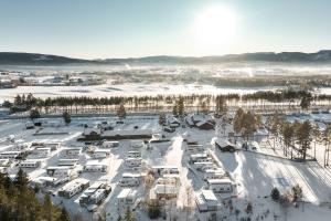 an aerial view of a parking lot covered in snow at First Camp Bø - Telemark in Bø