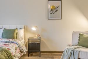 A bed or beds in a room at Appartamenti Vista Mole, Centro a 15 min - Luxury Suites & fast WiFi