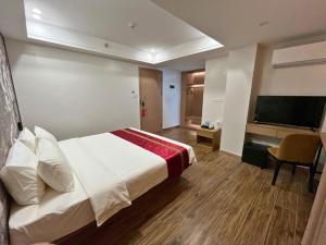 TV a/nebo společenská místnost v ubytování L' Asuncion Hotel
