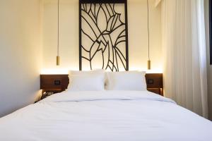 Ένα ή περισσότερα κρεβάτια σε δωμάτιο στο Ramban Hotel Jerusalem