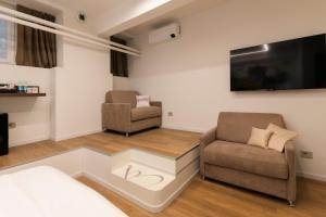 TV a/nebo společenská místnost v ubytování InscìBell Guest House + 10 fotografií