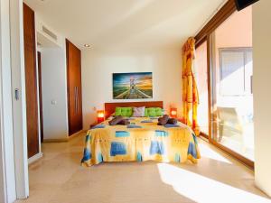 a bedroom with a large bed and a large window at Apart Ibiza Close to Hi & Ushuaia SEA FRONT in Illes Balears +34 photos