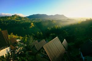 an aerial view of a city with mountains and buildings at Wild Flower Waterfall Villa in Talawakele +5 photos