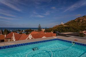 a large swimming pool on top of a house at 105 Mossel Cove Unique & Trendy in Mossel Bay