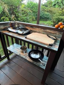 a table with a pan on top of a table at Hale Nonno in Pahoa