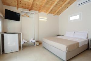 Postel nebo postele na pokoji v ubytování Scala Village Camping