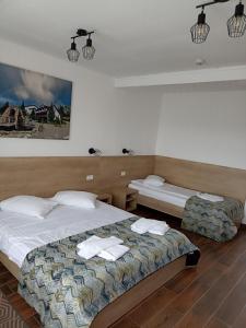 Кровать или кровати в номере Club Vila Bran