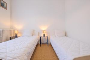 Posteľ alebo postele v izbe v ubytovaní Miraflores, appartement en ville