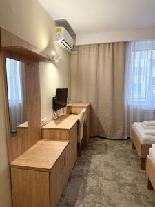 Posteľ alebo postele v izbe v ubytovaní Hotel TM