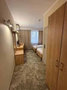 Posteľ alebo postele v izbe v ubytovaní Hotel TM