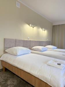 Posteľ alebo postele v izbe v ubytovaní Hotel TM