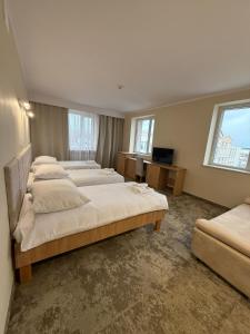 Posteľ alebo postele v izbe v ubytovaní Hotel TM