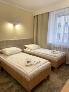 Posteľ alebo postele v izbe v ubytovaní Hotel TM