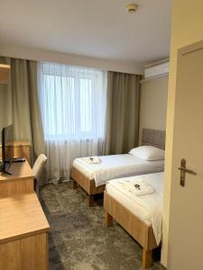 Posteľ alebo postele v izbe v ubytovaní Hotel TM