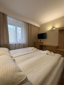 Posteľ alebo postele v izbe v ubytovaní Hotel TM