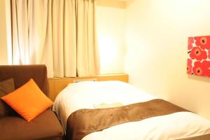 Postel nebo postele na pokoji v ubytování Hotel Estacion Hikone