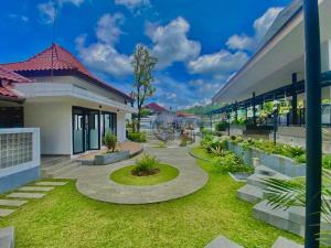 Zahrada ubytování HOTEL & WISMA BINTANG JADAYAT