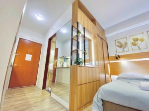 Giường trong phòng chung tại UNIT B218