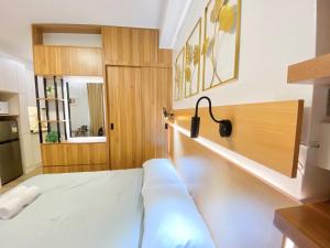 Giường trong phòng chung tại UNIT B218