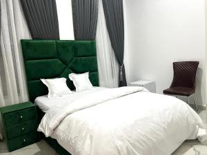 Postel nebo postele na pokoji v ubytování Mitop Homes + 6 fotografií