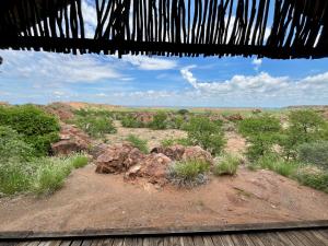 a view of a desert with rocks and trees at Kaoxa Bush Camp in Linton