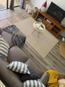 an aerial view of a living room with a couch at Noosa Sound - 2brm Townhouse in Noosaville