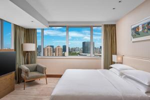 Rúm í herbergi á Four Points by Sheraton Shanghai, Daning