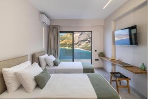 Postel nebo postele na pokoji v ubytování Avithos - Lassu Retreat + 37 fotografií