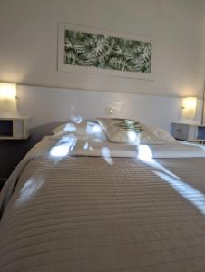 Postel nebo postele na pokoji v ubytování L'Auberge des Collines