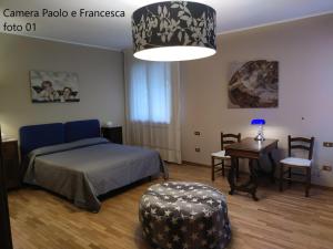 Postel nebo postele na pokoji v ubytování B&B Paolo e Francesca