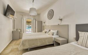 Letto o letti in una camera di Ecoresort Hotel Zefyros