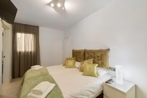 Ένα ή περισσότερα κρεβάτια σε δωμάτιο στο Apartamento tríplex nuevo en la Savina